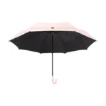 Joli parapluie rose manuel avec motif doube-coeur, trèes efficace.