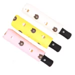 3 parapluies automatiques rose, jaune et blanc à motif de tête d'ourson.