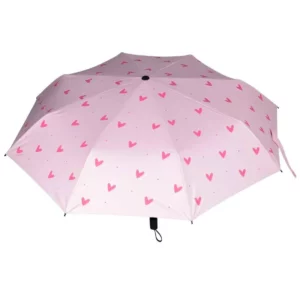 Parapluie manuel pour femme de couleur rose avec des cœurs sur le dessus.