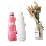 beaux parapluies cloche rose et blanc à motif dentelle de 80 cm de diamètre.