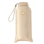 Étui beige doré pour parapluie anti-UV de poche, design raffiné et compact.