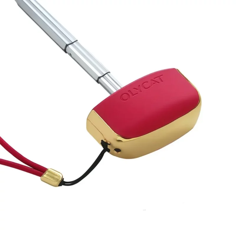 Pommeau rouge et dorée d'un parapluie anti-UV, élégance et confort.