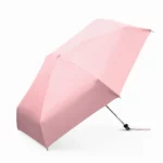 Parapluie anti-UV rose pastel, format pliable pratique et moderne.