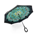 Parapluie inversé motif floral bleu-vert, poignée en C ergonomique. Protection anti-UV, anti-gouttes, ouverture facile. Élégant et original sous la pluie.