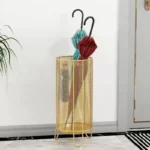 J'adore ce porte-parapluie doré et grillagé de 54 cm de haut.