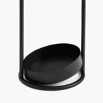 Support parapluie nordique design minimaliste en métal noir, moderne et pratique pour recueillir l'eau, parfait pour une entrée.