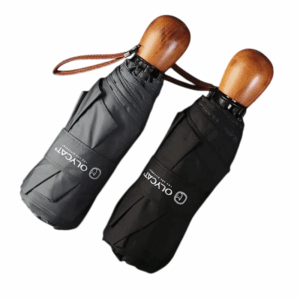 Parapluies pliants gris et noir avec poignée bois élégante. Format compact, design premium, idéal pour le quotidien sous la pluie.