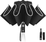 Parapluie noir robuste, ouvert, avec gouttes d’eau visibles. Poignée LED pratique, design pliable. Protection efficace sous la pluie.