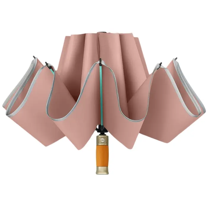 Parapluie rose saumon ou bieux rose comme on dit, modèle luxe élégant automatique avec son pommeau bois premium.