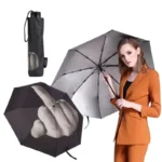 Parapluie pliable noir avec doigt d'honneur imprimé. Compact, original, intérieur argenté et ouverture manuelle pratique.