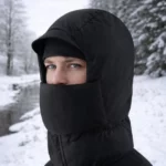 Capuche noire thermique avec cache-visage. Protection maximale contre neige, froid et rafales. Accessoire idéal hiver, ski, randonnée, outdoor extrême.
